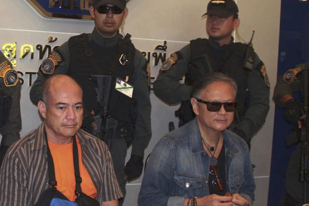 Former governor of western Palawan province Joel Reyes (right) and his brother Mario after being arrested in Thailand in September, 2015. Photo: AP