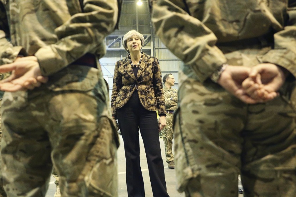 British Prime Minister Theresa May speaks with troops serving at one of two military bases Britain maintains on the east Mediterranean island of Cyprus. Photo: EPA