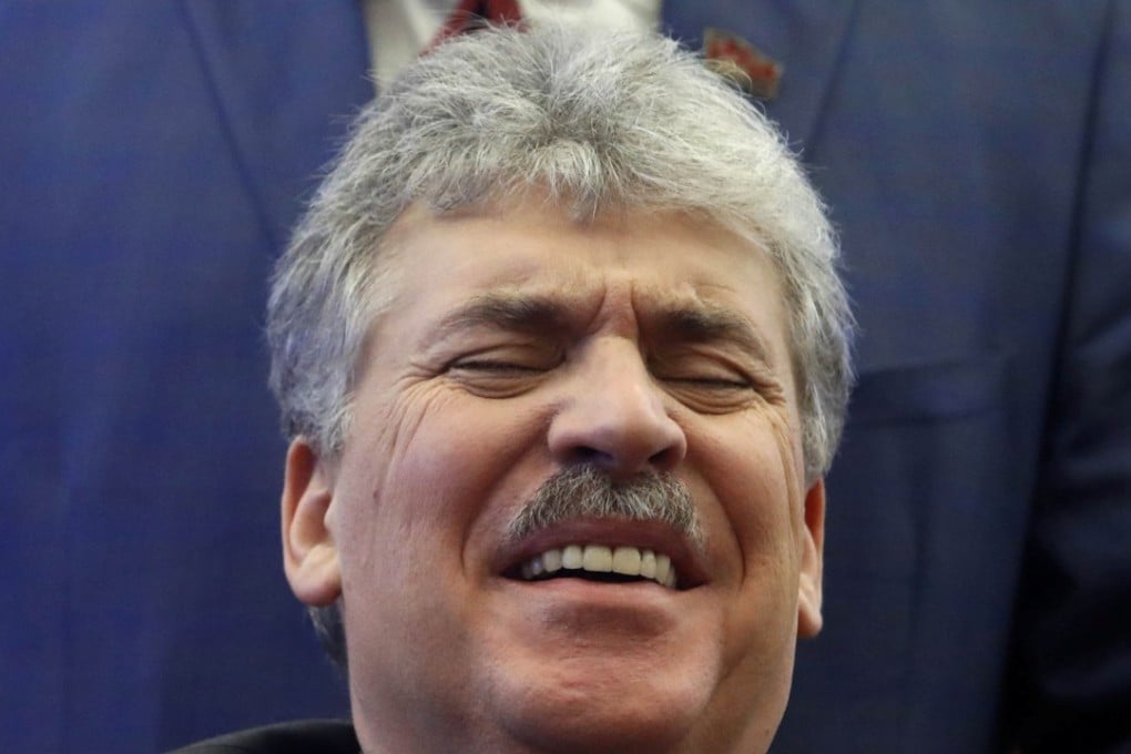 Pavel Grudinin, businessman and Communist Party presidential candidate, reacts while submitting his documents to be registered at the Central Election Commission in Moscow. Photo: Reuters