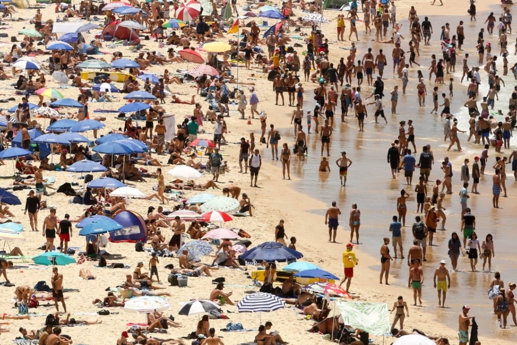 People crowd Bondi beach in Sydney on Sunday, the city’s hottest day since 1939. Photo: EPA