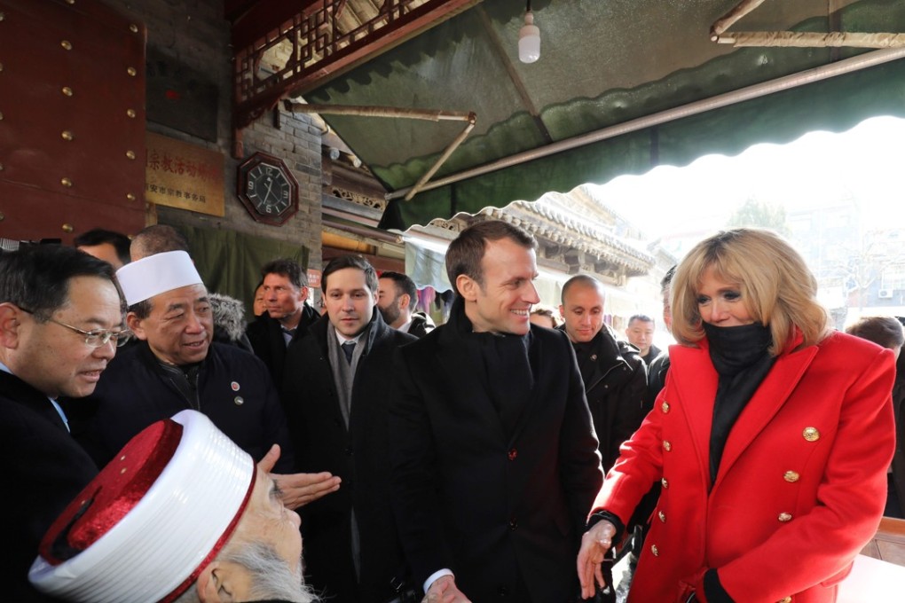 French President Emmanuel Macron (centre) and his wife Brigitte (right), pictured during their visit to a mosque in Xian on Monday. Photo: Agence France-Presse