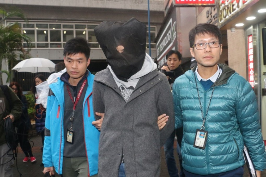 Police take the suspect, who was arrested on Saturday, to his workplace to gather evidence. Photo: Handout