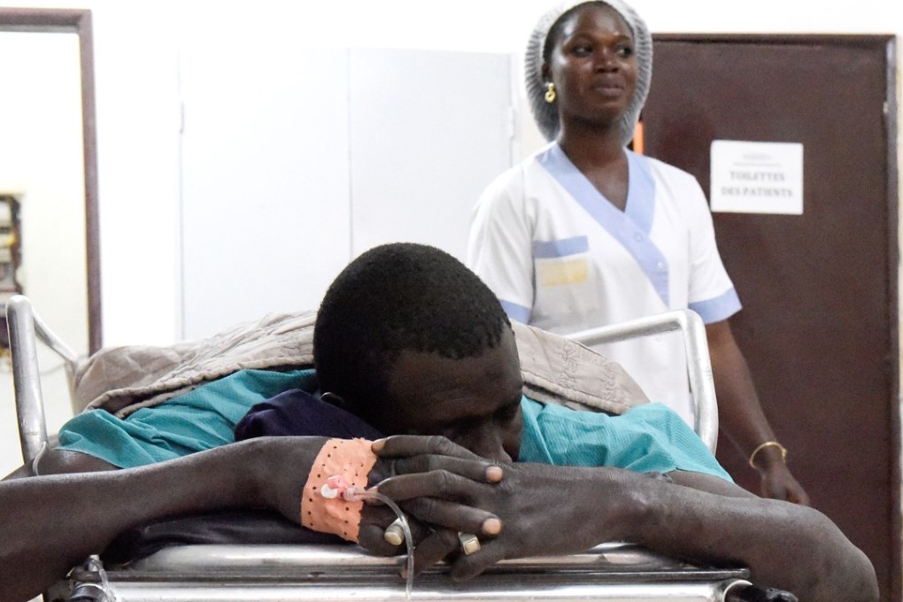 A victim of an attack by armed men in the Bayotte forest lies on a hospital gurney in the regional capital Ziguinchor, southern Senegal on Sunday. Photo: Agence France-Presse