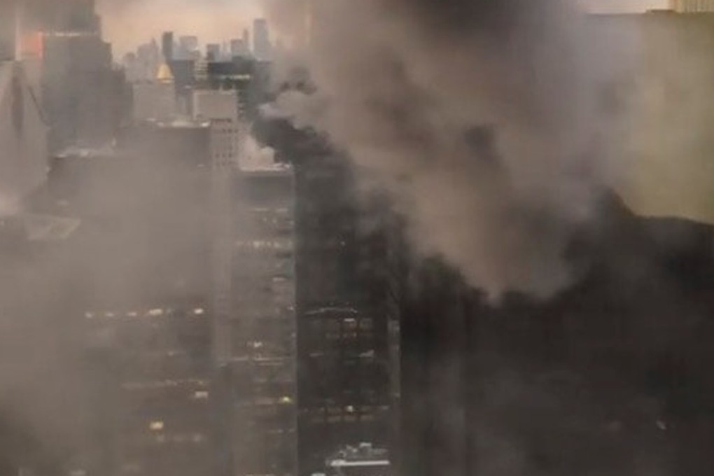 Smoke coming out of Trump Tower as seen from a building nearby, in New York City. Photo: Reuters