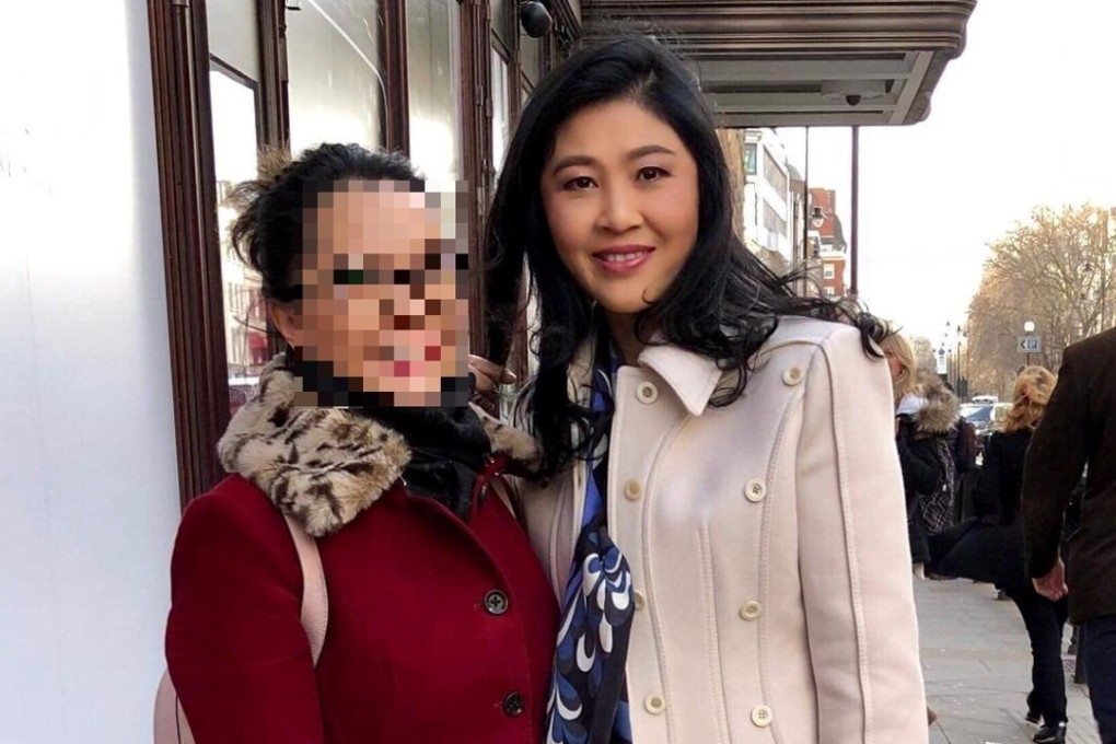 Former Thai prime minister Yingluck Shinawatra (right), poses with an unidentified woman outside Harrods department store in London. Photo: Twitter / @zenjournalist