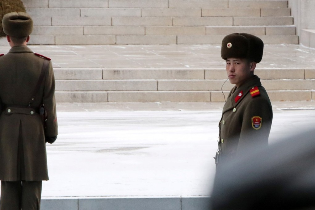 North Korean soldiers stand guard during high level talks in the demilitarised zone separating the two Koreas. Photo: Reuters