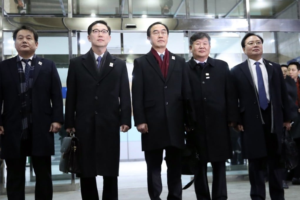 South Korean Unification Minister and chief delegate Cho Myoung-gyon (centre) and delegates pose at the South-North Dialogue Secretariat building in Seoul before leaving for the border village of Panmunjom. Photo: EPA