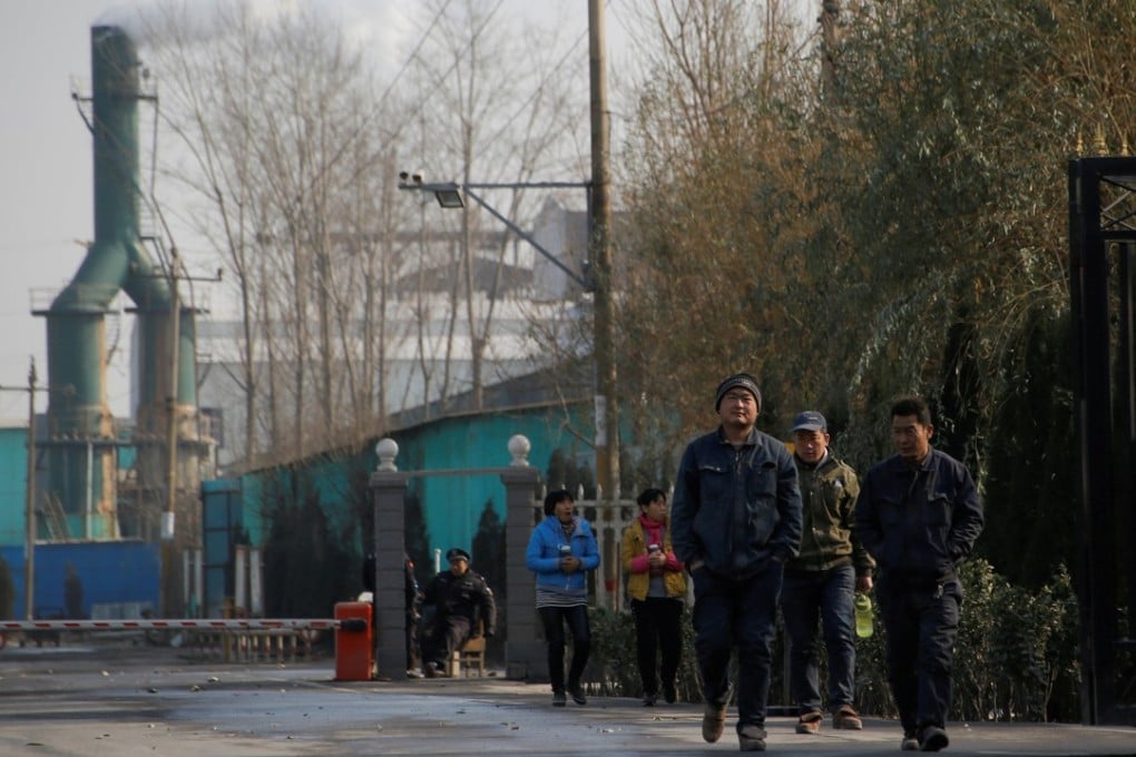 Workers leave a factory in rural Gaoyi county, known for its ceramics production, near Shijiazhuang, Hebei province in December. Shijiazhuang saw the biggest improvement in PM2.5 levels in late 2017. Photo: Reuters