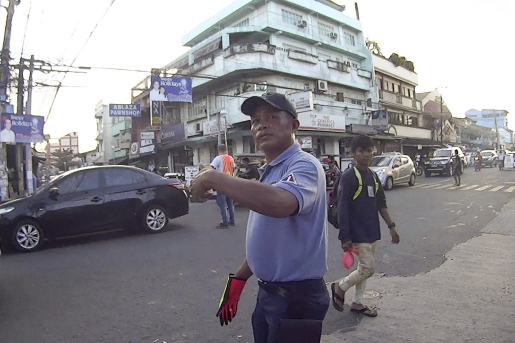 Deep in the heart of Quezon City, Manila there’s a traffic controller busting dance moves. Led my Ramon Mangalindan the team directs cars, trucks, tricycles and bicycles all day, but at 7am and 4pm, they like to put on a show. Photo: Benjamin O'Rourke