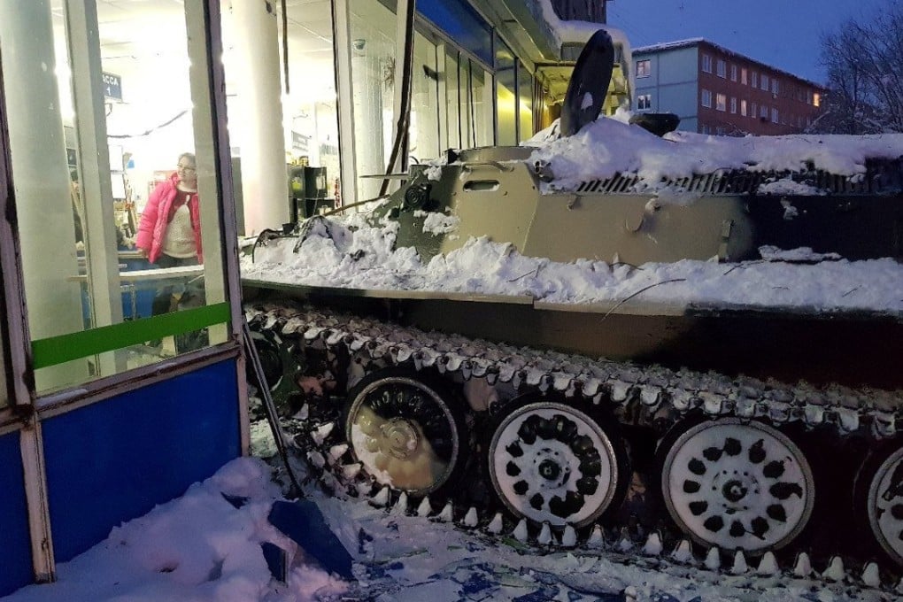 This armoured personnel carrier was rammed into a convenience store in theRussian town of Apatity, before the driver got out and stole a bottle of wine. Photo: Reuters