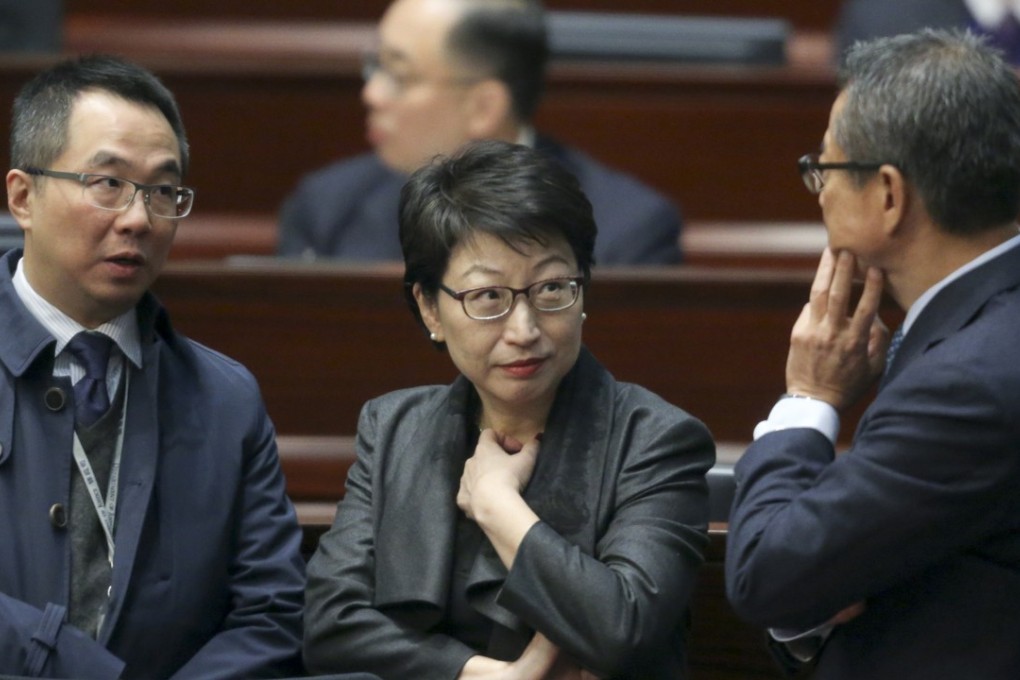 Beleaguered Secretary for Justice Teresa Cheng talks to Financial Secretary Paul Chan Mo-po (right) at the Legislative Council last Thursday. Photo: Sam Tsang