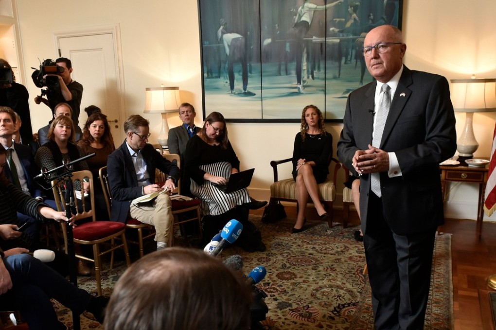 US Ambassador to The Netherlands, Peter Hoekstra (right) gestures as he speaks during a heated press conference at the US embassy, in The Hague, on Wednesday. Photo: Agence France-Presse