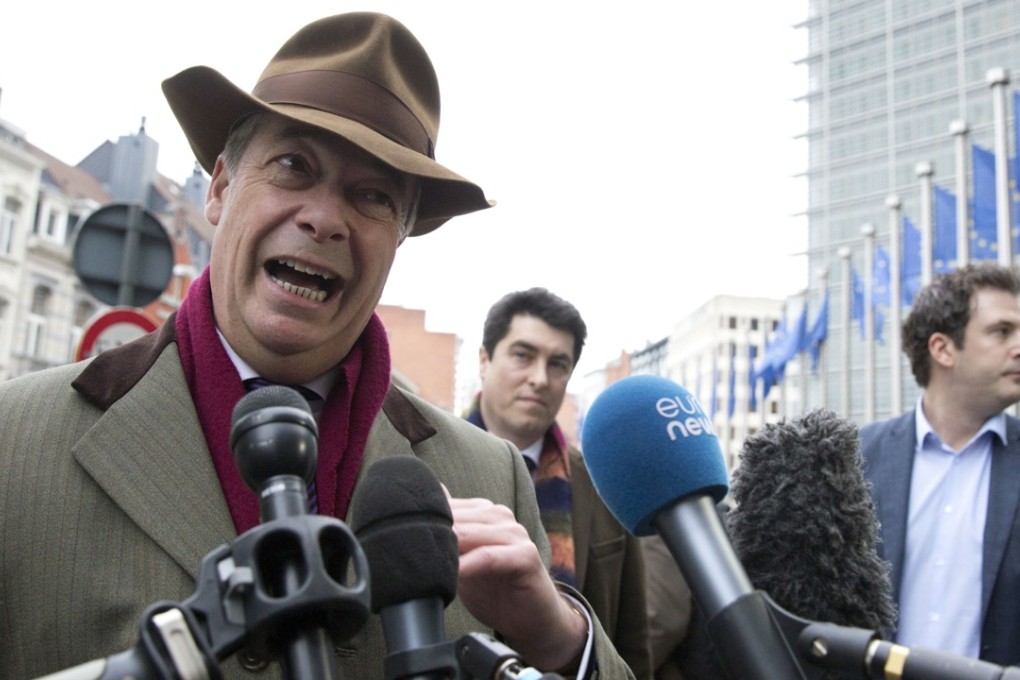 Former UKIP leader and current MEP Nigel Farage speaks with the media outside EU headquarters in Brussels on Monday. Photo: AP