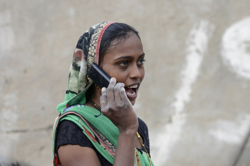 An Indian woman speaks on a mobile phone in Suraj village in Mehsana district, India. Transsion targeted untapped rural markets in the country. Photo: AFP