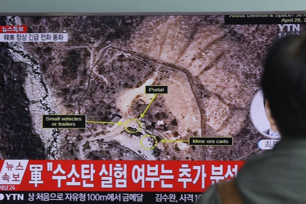 A man watches a television in Seoul showing North Korea's nuclear test site at Mount Mantap. Photo: AP