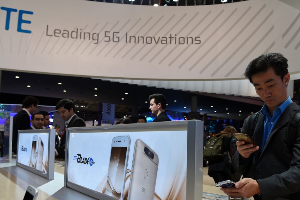 A visitor tests a smartphone at the booth of ZTE Corp during the 2017 Mobile World Congress exhibition in Barcelona. Shenzhen-based ZTE plans to launch a 5G smartphone either late this year or in early 2019, according to the company’s head of US operations. Photo: Agence France-Presse