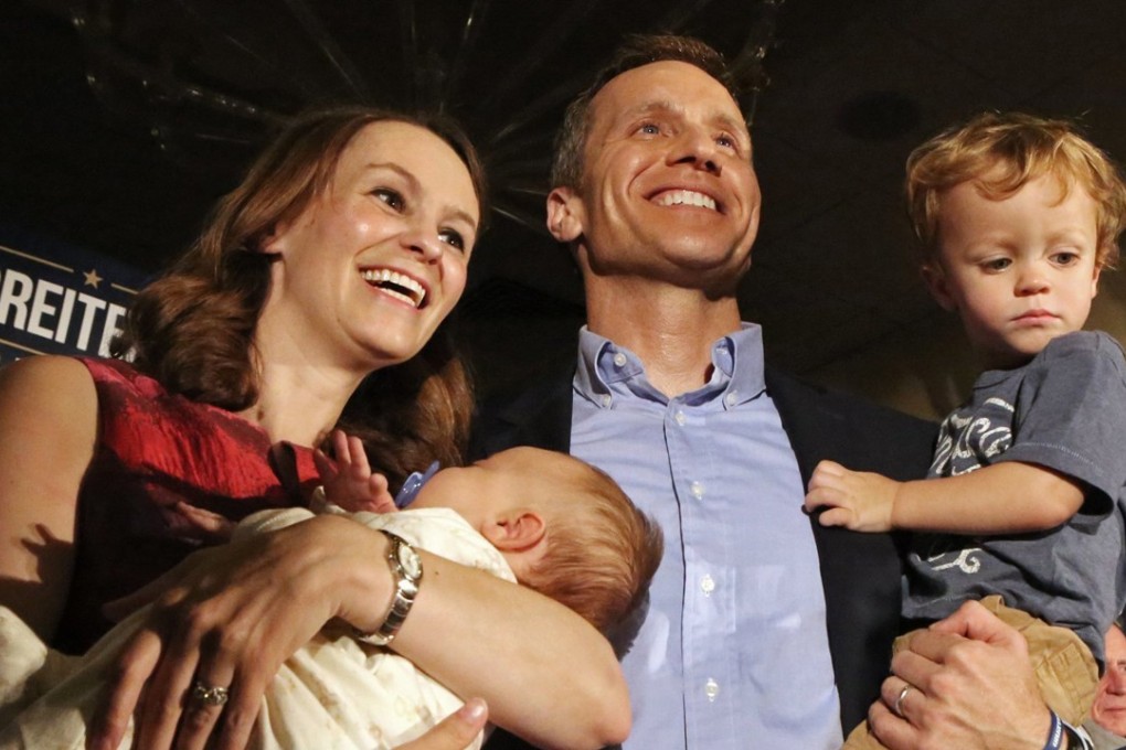 In this August 2, 2016, photo, Eric Greitens poses with his wife, Sheena and his two sons Jacob and Joshua at a watch party at the Doubletree Hotel in Chesterfield, Missouri, after he was declared the winner in the Republican Governor primaries. Greitens has acknowledged being “unfaithful” in his marriage but denies allegations that he blackmailed a woman to stay quiet. Photo: St Louis Post-Dispatch via AP
