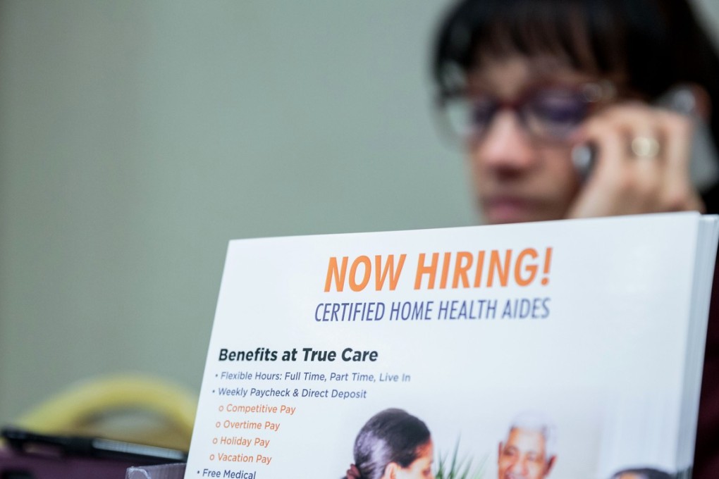 A “Now Hiring” brochure for home health aides is displayed during a New York Career Fairs event in New York, in December. Jobless claims in the US have hit a three month high. Photo: Bloomberg