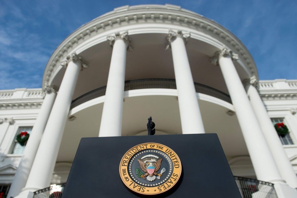 The US Presidential Seal on the podium before President Donald Trump speaking about the passage of tax reform legislation on the South Lawn of the White House in December. Photo: Reuters