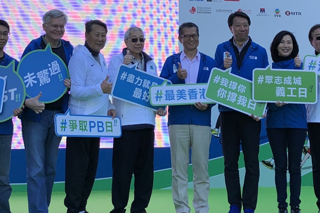 Officials at the opening of the marathon carnival to launch the 2018 Standard Chartered Hong Kong Marathon in Victoria Park. Photo: Chan Kin-wa