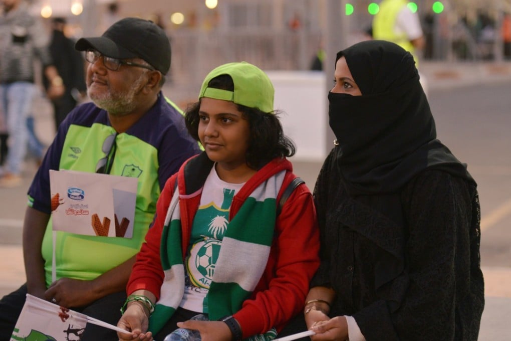 A Saudi family arrives to watch the soccer match between Al-Ahli against Al-Batin at the King Abdullah Sports City in Jeddah. Photo: Reuters
