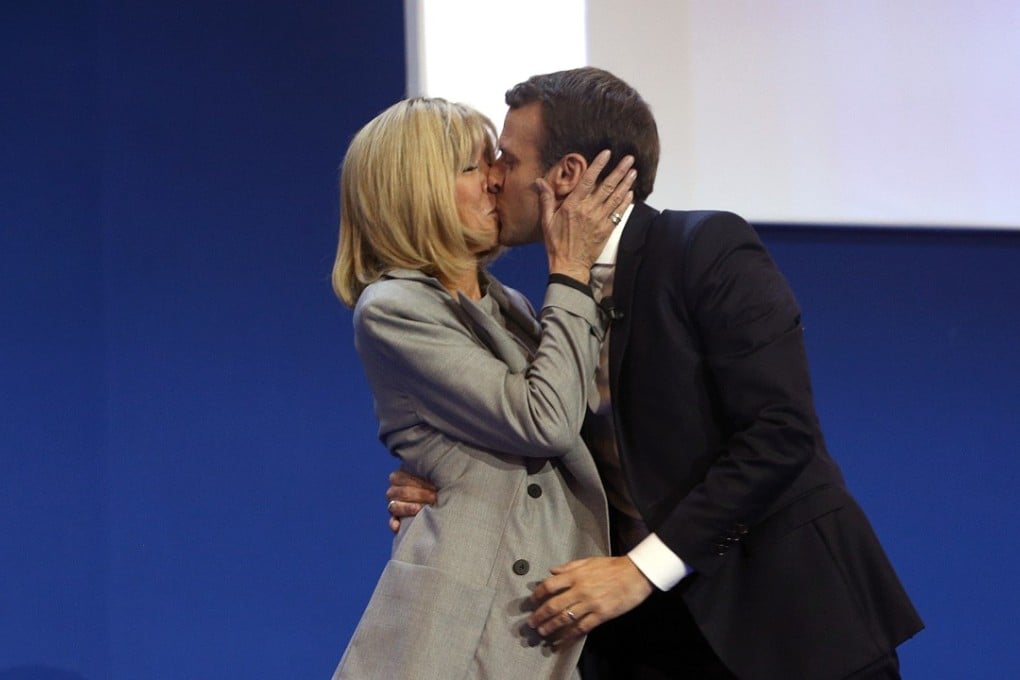 Emmanuel Macron kisses his wife Brigitte before addressing his supporters at his election day headquarters in Paris in 2017. File photo: AP