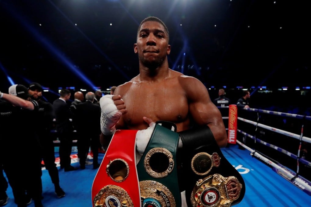 Anthony Joshua celebrates at after defending his belts against Carlos Takam in Cardiff. Photo: Reuters