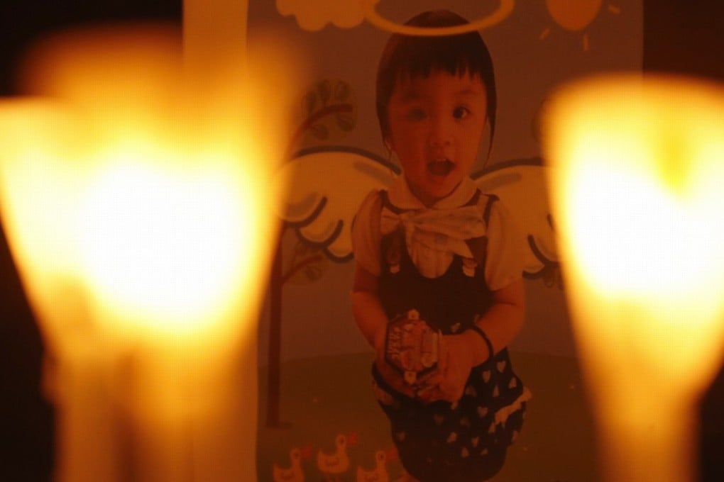 Mourners take part in a candlelight vigil for five-year-old Chan Siu-lam outside Hong Kong government headquarters on Saturday. The girl died after being repeatedly thrown at the ceiling and poked in the chest with scissors at home. Photo: Handout