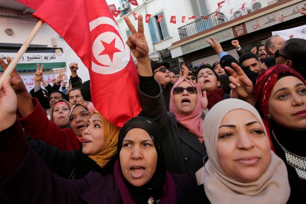 People at a demonstration on the seventh anniversary of the toppling of former Tunisian president Zine El-Abidine Ben Ali, in Tunis. Photo: Reuters
