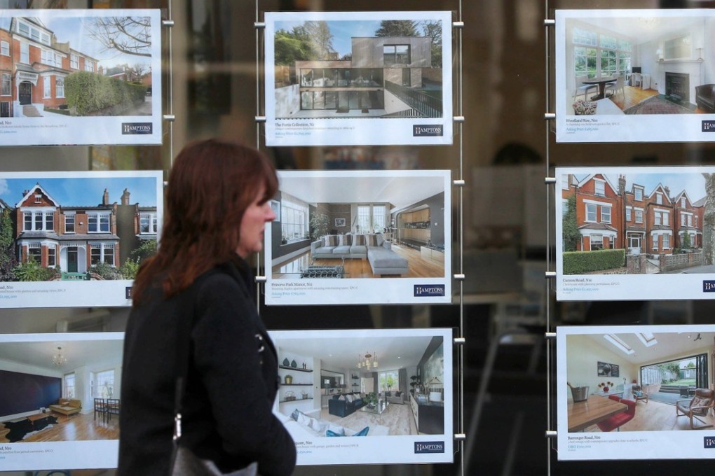 A property agent’s window in London. Asking prices for London homes fell by most since 2009 in January. Photo: EPA