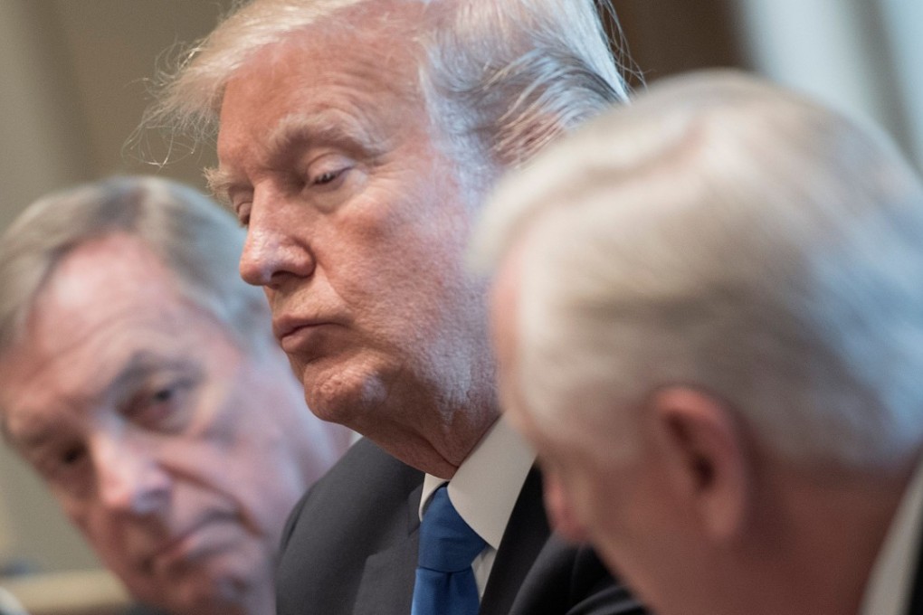 (US President Donald Trump (centre) and US Senator Dick Durbin (left), listen as US Congressman Steny Hoyer ((right) speaks during a meeting with bipartisan members of the Senate on immigration at the White House in Washington, DC, on January 9. Photo: AFP