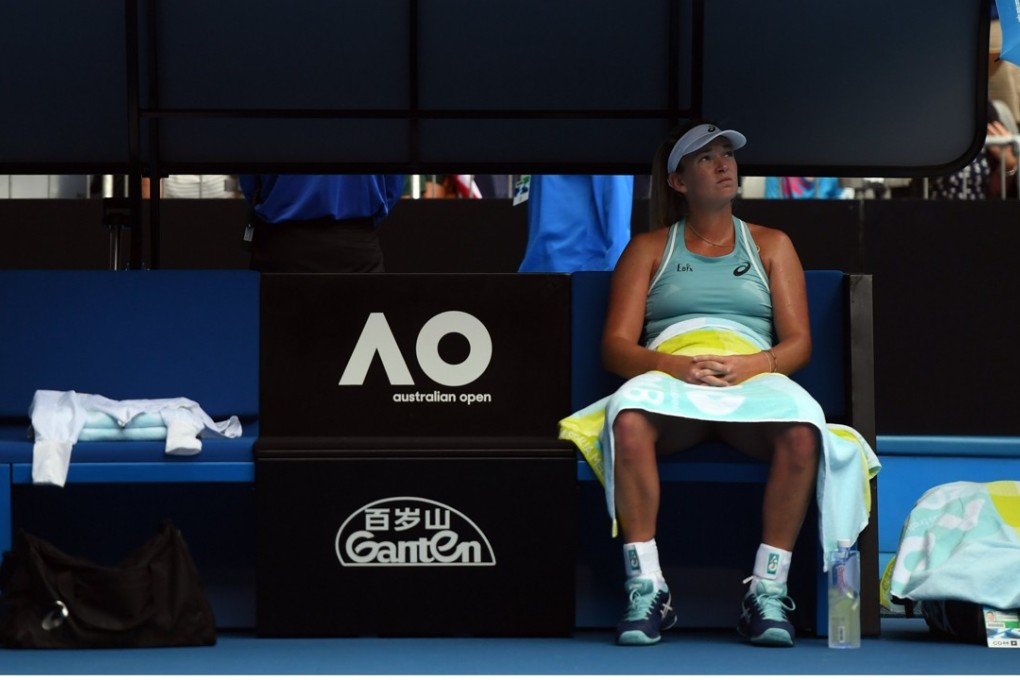Coco Vandeweghe of the USA waits during a rain delay against Timea Babos of Hungary in round one of the Australian Open tennis tournament. Photo: EPA