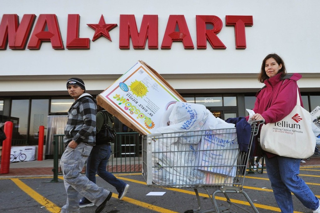 Holiday shoppers leave the Wal-Mart store in Fairfax, Virginia, in this November 27, 2009 file photo. Photo: AFP Photo/Paul J. Richards