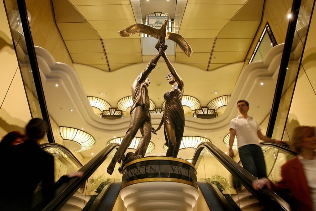 The bronze sculpture of the couple, who died in a car crash in Paris two decades ago, has been on display at the west London department store since 2005. File photo: AFO