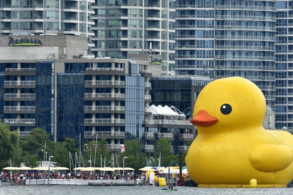 A 19-metre-tall rubber duck floats in Toronto Harbour. The city’s property sales market has cooled over the past seven months, but the average price of a home is still C$735,021. Photo: EPA