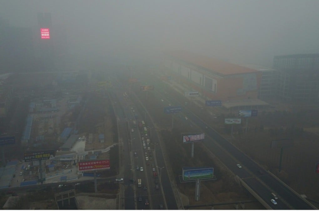 Buildings and roads are shrouded in smog in the city of Sanhe, Hebei province on January 5. Photo: EPA