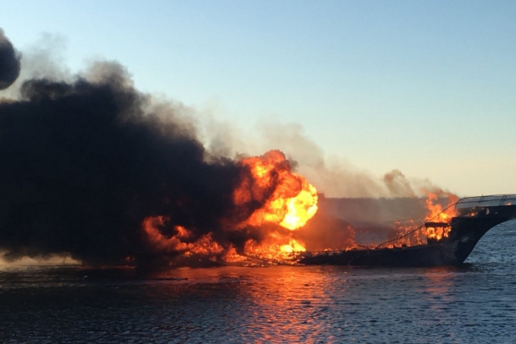 Flames engulf a Florida casino ship’s passenger shuttle boat on Sunday in the Tampa Bay area. Photo: AP