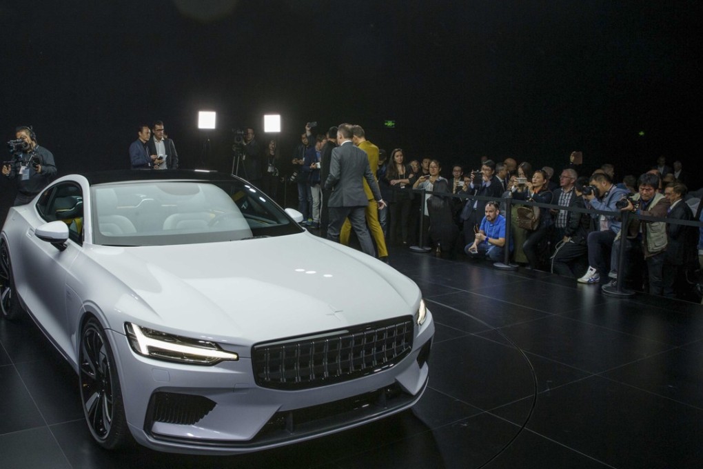 Attendees look at the Polestar 1 during its unveiling in Shanghai, China Tuesday Oct. 17, 2017. Volvo Cars' performance electric car brand, Polestar, unveiled a four-seat coupe in lightweight carbon fibre as its first model Tuesday, adding to competition in a market dominated until now by Tesla. Photo: Chinatopix via AP.
