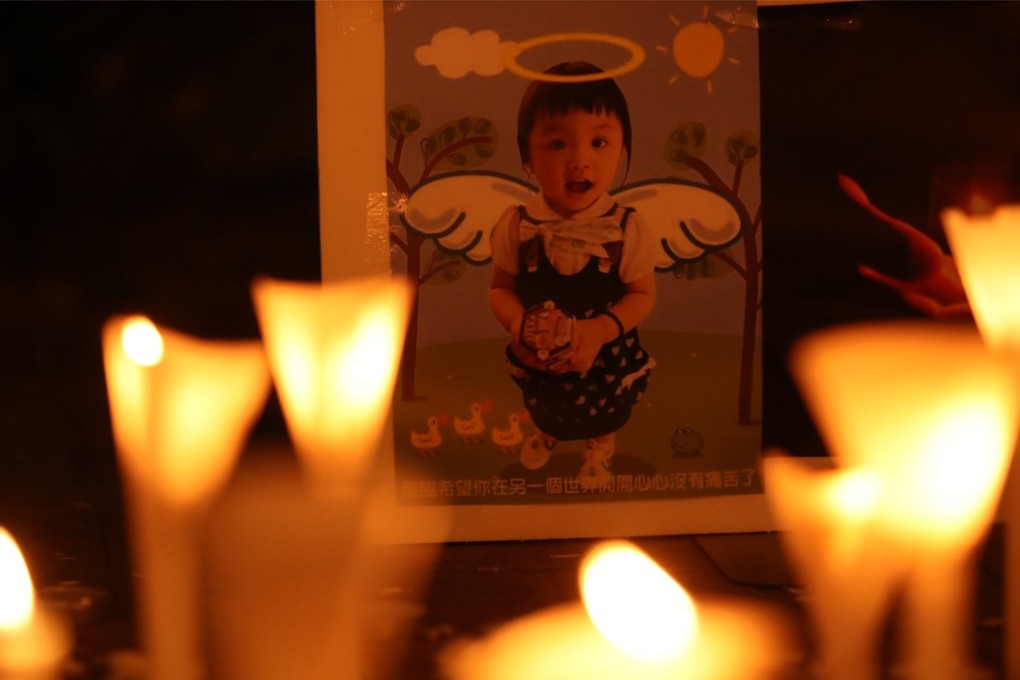 Mourners take part in a candlelight vigil for five-year-old Chan Siu-lam outside Hong Kong government headquarters on Saturday. The girl died after being repeatedly thrown at the ceiling and poked in the chest with scissors at home. Photo: Handout