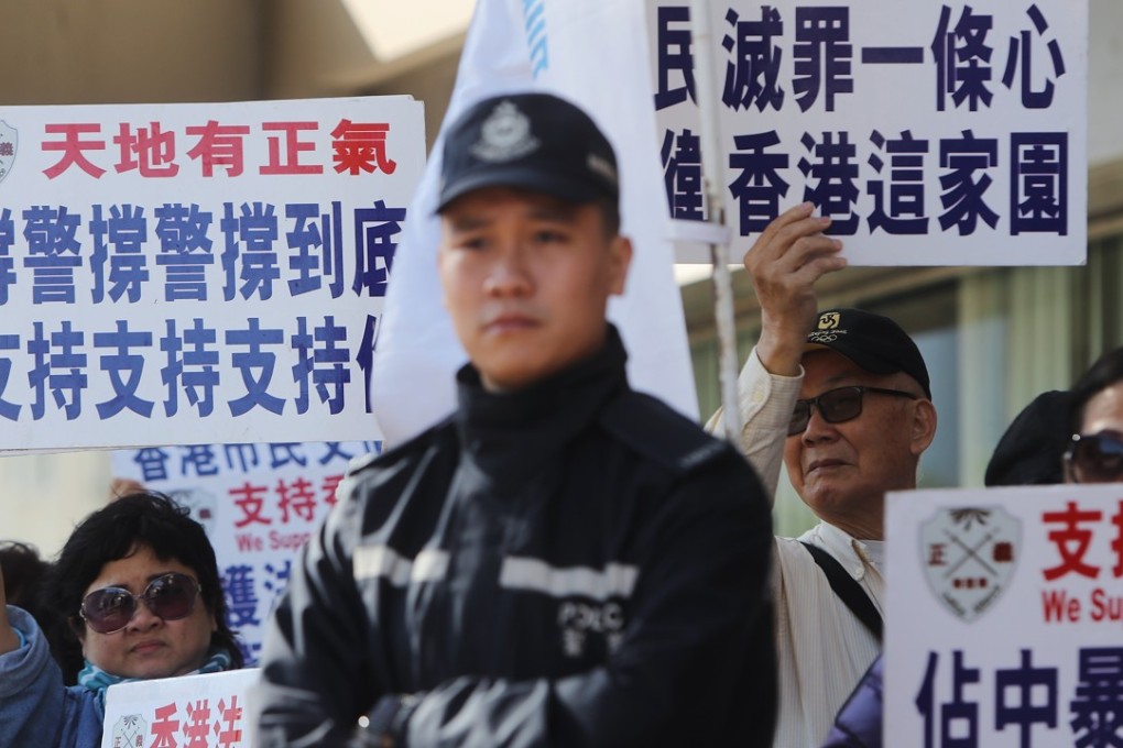 Members of the Alliance in Support of Police Force appear outside court in support of retired police superintendent Frankly Chu. Photo: Winson Wong