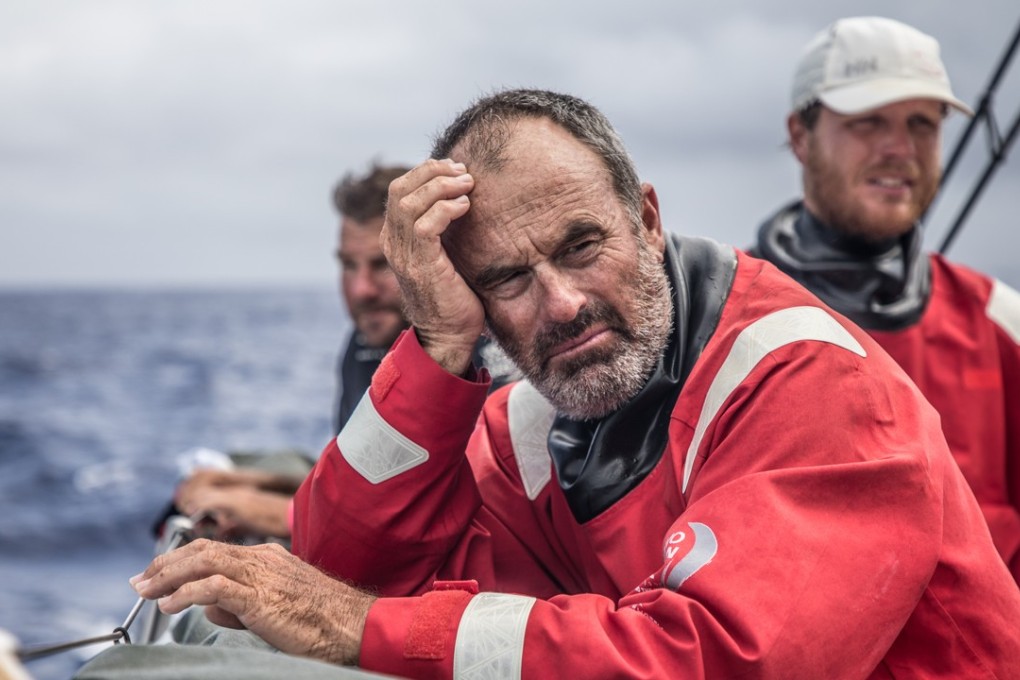 Scallywag crew wait for the wind to pick up again after sailing under a cloud line. Photo: Konrad Frost/Volvo Ocean Race.