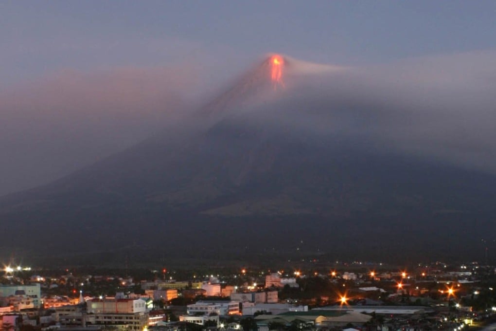 Lava flows can be seen at the top of Mounth Mayon in Legazpi, southeast of Manila, during an eruption in 2009. Photo: AFP