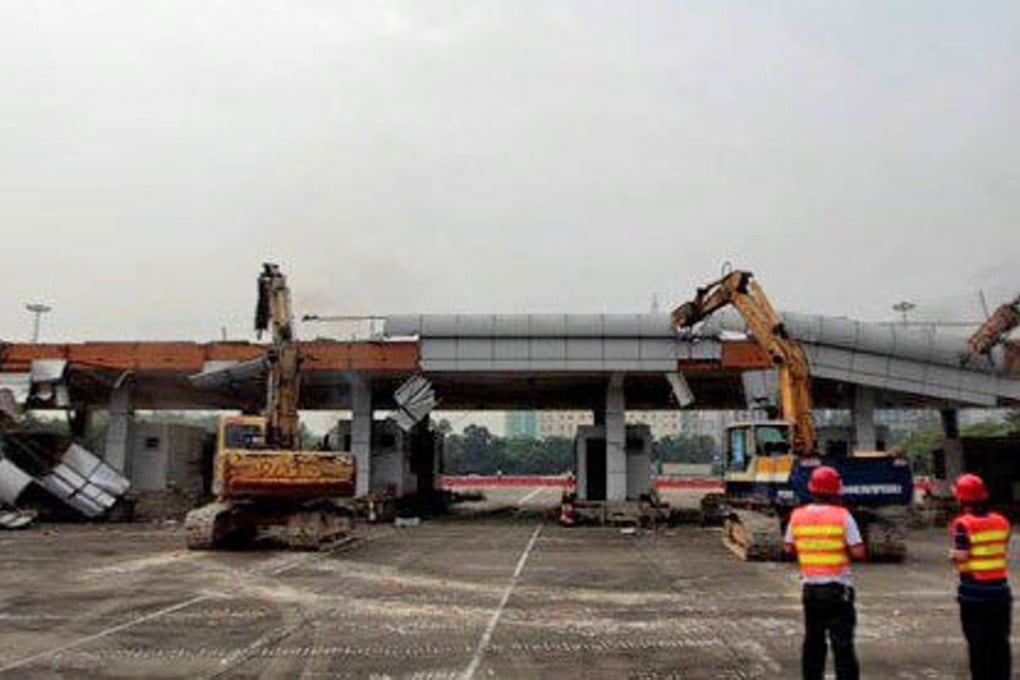 Heavy machinery pull apart the Tongle checkpoint to the Shenzhen Special Economic Zone. Photo: Handout