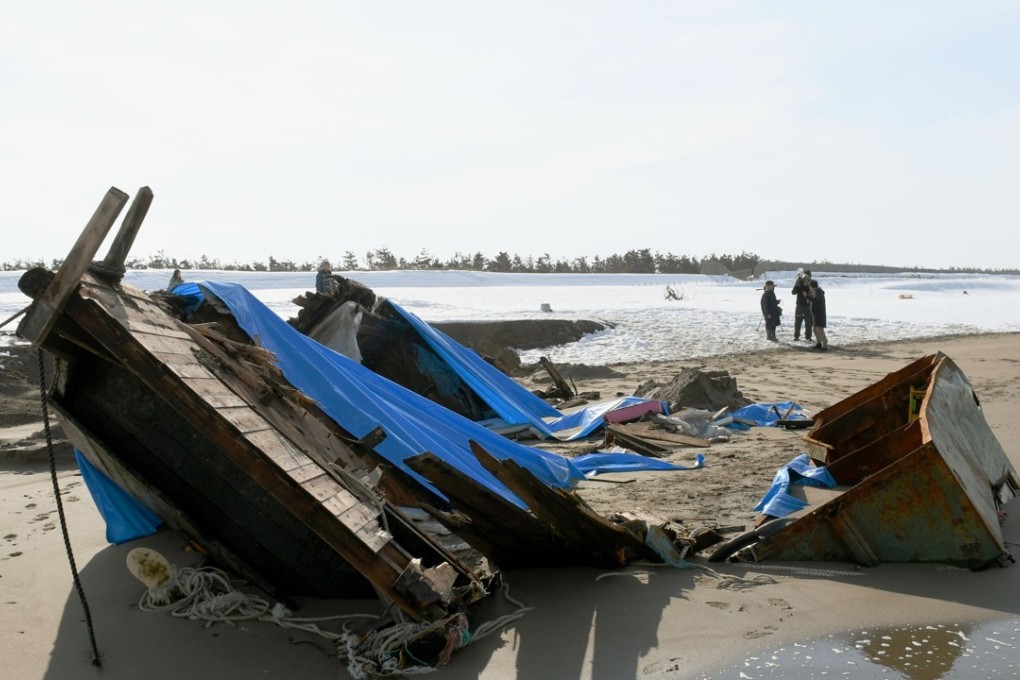 The wooden fishing boat that washed ashore on a beach in Kanazawa, Ishikawa Prefecture, Japan. Seven dead bodies, thought to be those of North Koreans, were found inside the boat. Photo: Kyodo