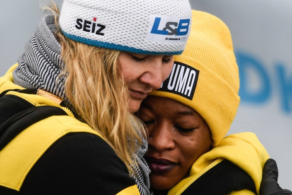 Jamaica’s Audra Segree (R) hugs coach Sandra Kiriasis from Germany. The women’s team will compete at the Winter Olympics in Pyeongchang. Photo: EPA