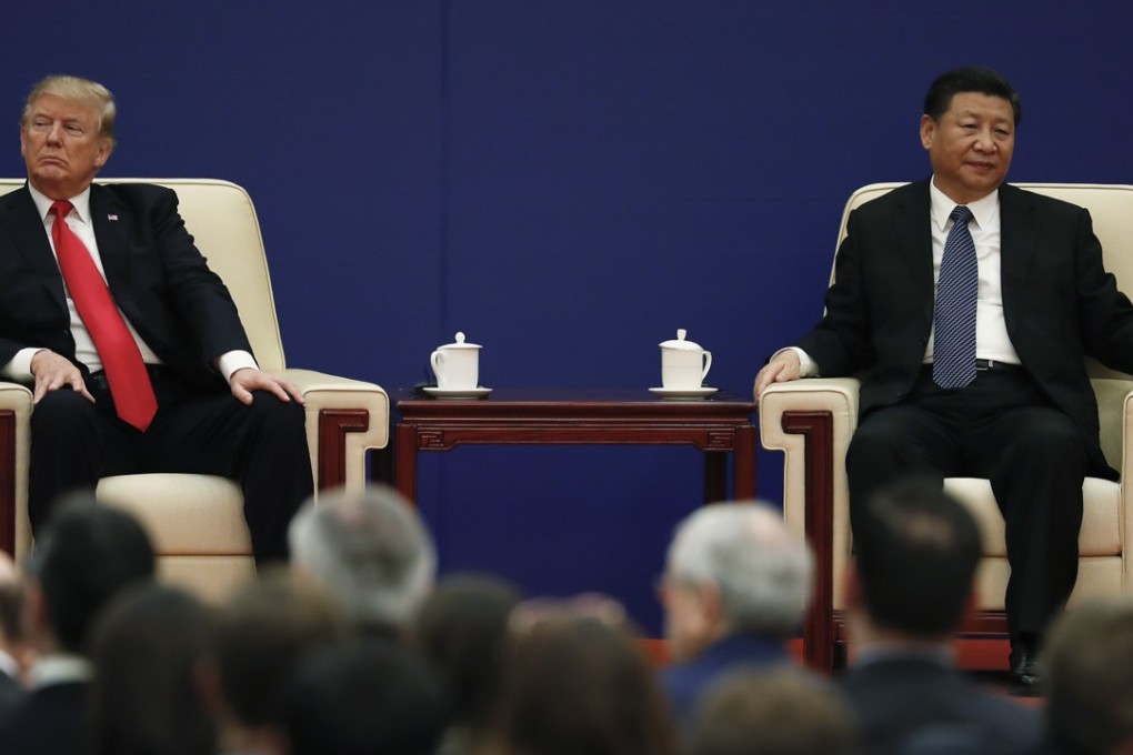 Donald Trump and Xi Jinping attend a business event during the US president’s visit to Beijing in November. Photo: AP