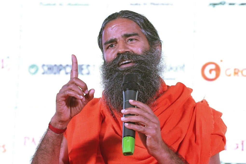 epa06442691 Indian Yoga Guru Baba Ramdev speaks during a press conference in New Delhi, India, 16 January 2018. Patanjali Ayurved, run by Yoga Guru Baba Ramdev, launched their e-commerce platform and joint announcement of partnership and agreements with leading e-retailers like Paytm, Flipkart, Amazon, Grofers and Shopclues for online sale and doorstep delivery of Patanjali products. Patanajali is valued at around 6–7 billion US dollars. EPA-EFE/HARISH TYAGI