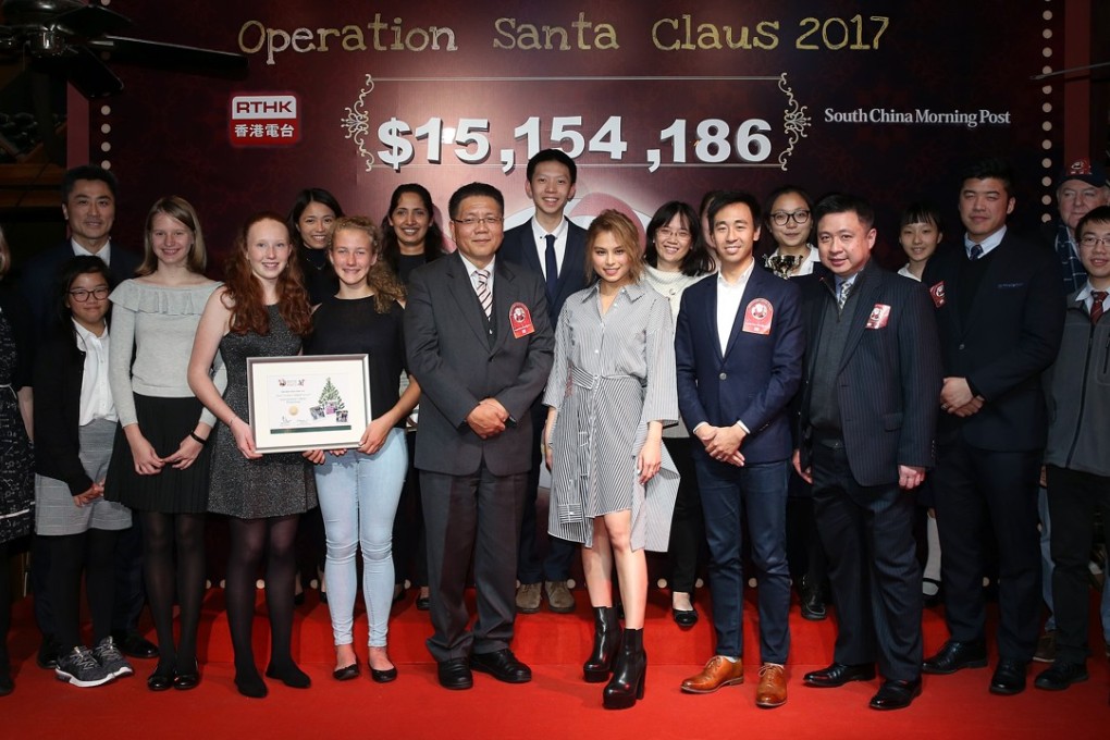 (From front row sixth left to right): Leung Ka-wing, RTHK’s director of broadcasting ; Operation Santa Claus 2017 Ambassador Gin Lee; and Gary Liu, CEO of South China Morning Post, at the Operation Santa Claus closing ceremony in Central. Photo: Sam Tsang