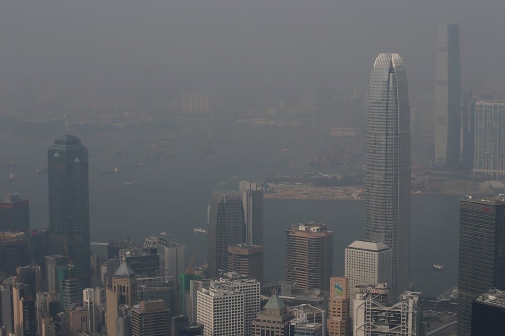 Smog covers Victoria Harbour in January 2017. Photo: David Wong