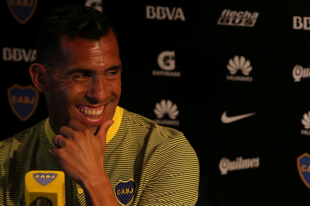 Carlos Tevez is all smiles in his presentation as a Boca Juniors player. Photo: Reuters